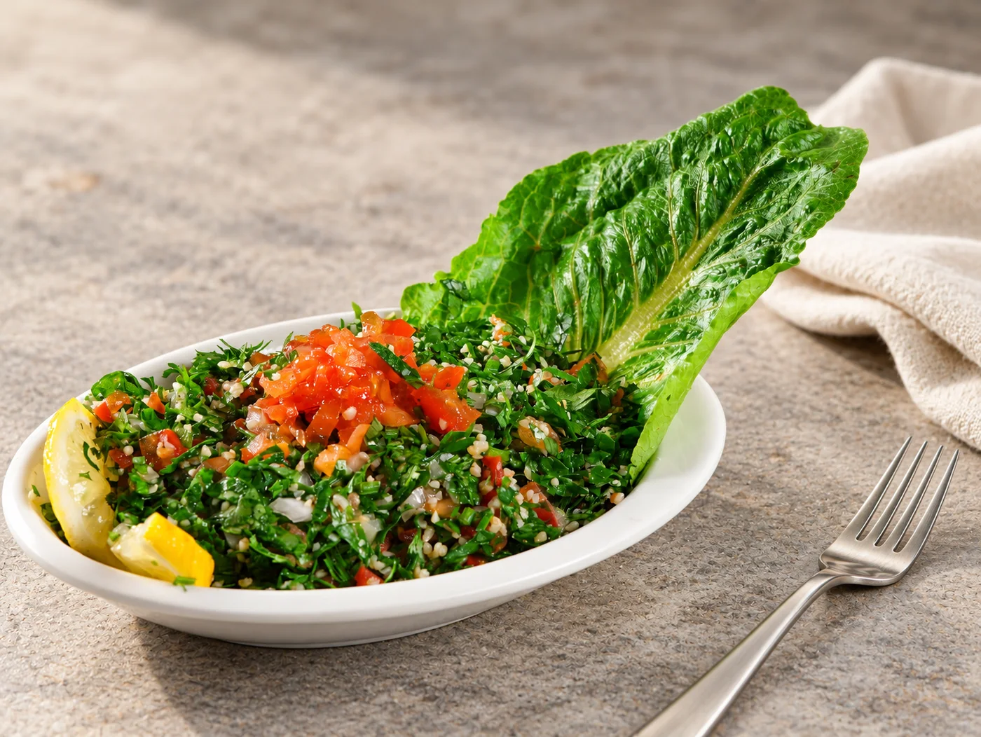 Fresh tabbouleh with lemon and romaine lettuce
